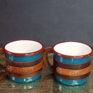 Set of 2 leather Wrapped Enamel mugs.